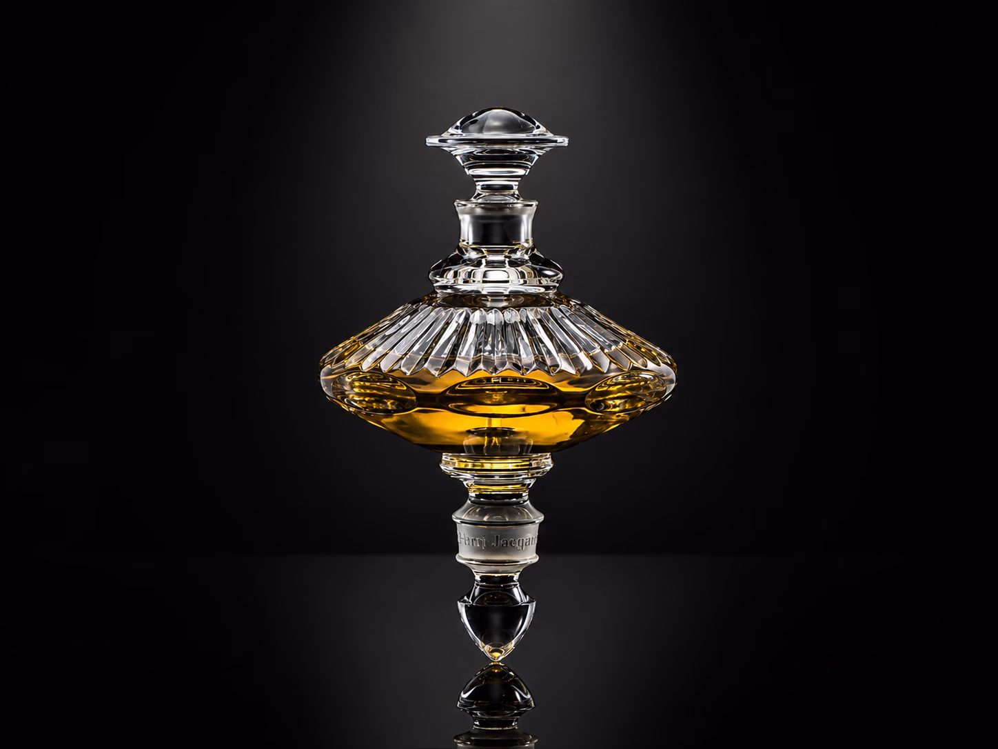 A pair of exquisite, handcrafted crystal spinning-top perfume flacons from the Henry Jacques Les Toupies collection